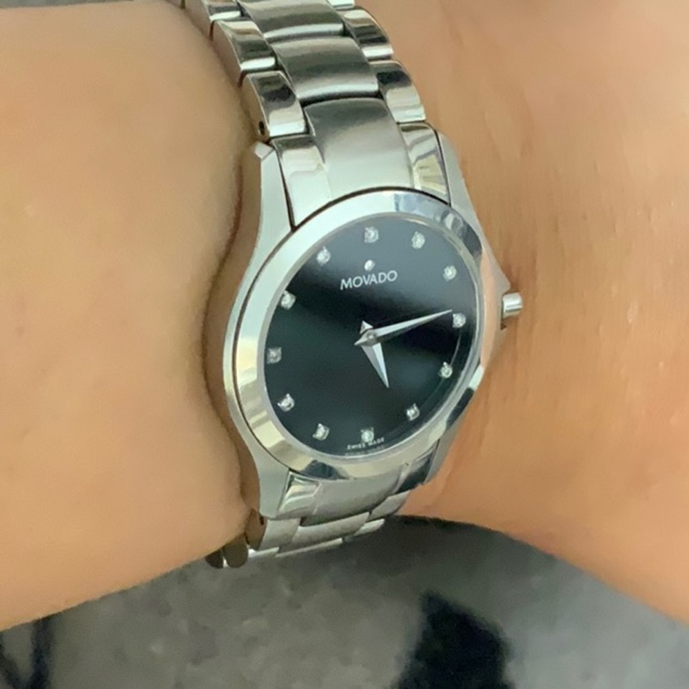 Movado diamond watch. Black/silver. Excellent condition. It comes with a box